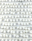 (TRIM) IVORY STRIP WITH POM POM BALL
