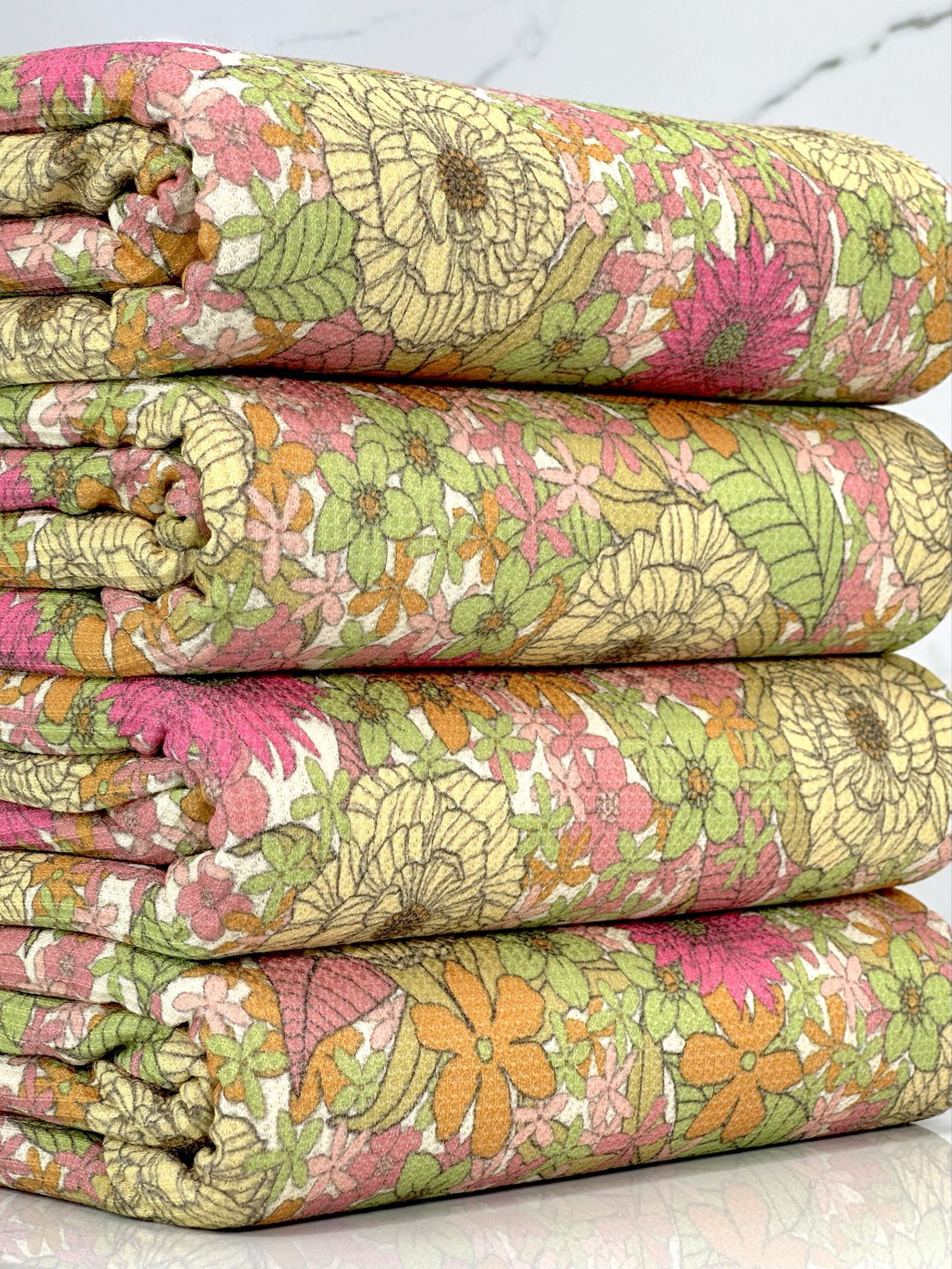 (THERMAL) PINK, YELLOW, GREEN, AND ORANGE FLOWERS ON OFF WHITE