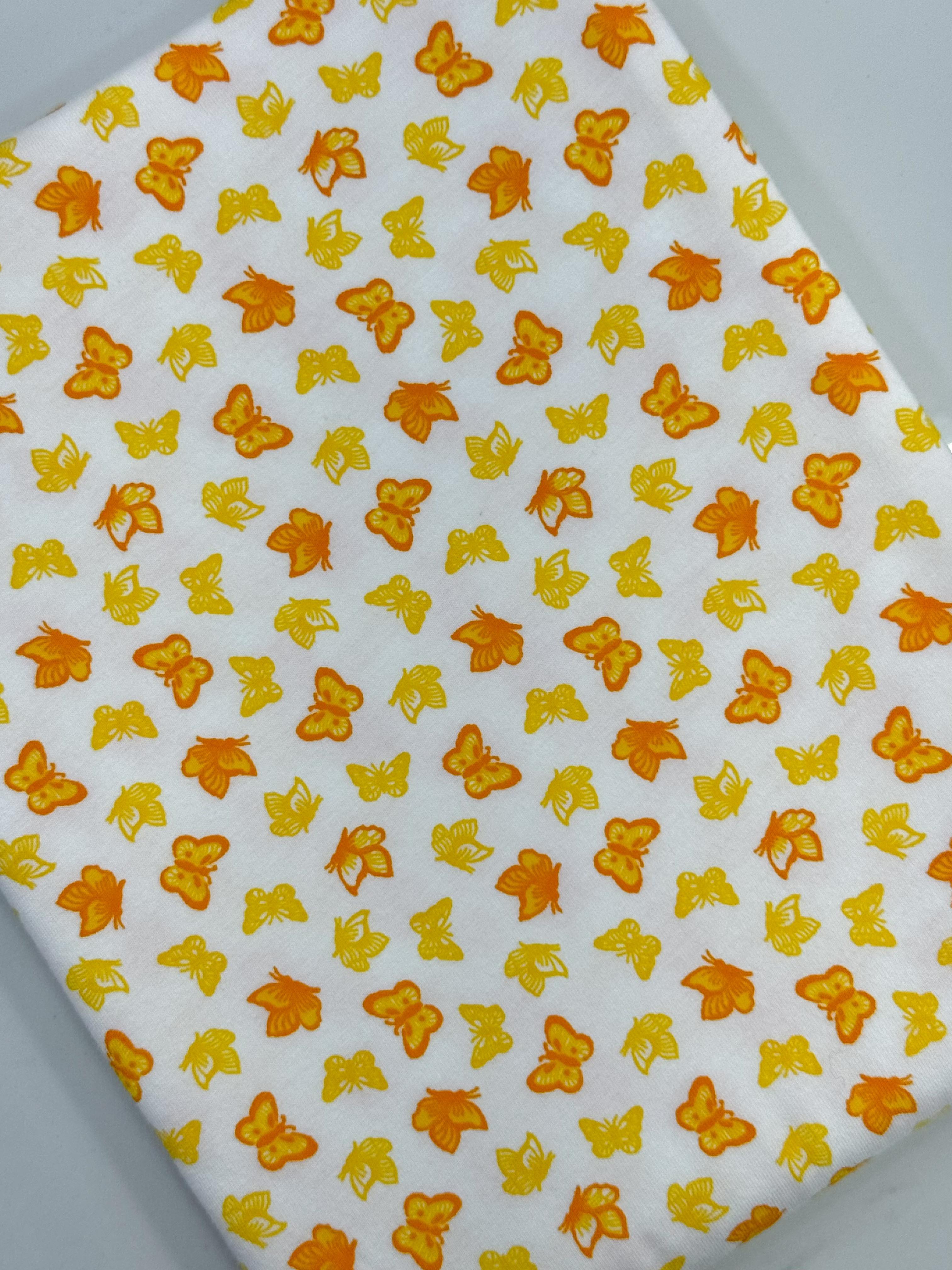 (COTTON SPANDEX) SMALL YELLOW AND ORANGE BUTTERFLIES ON OFF WHITE