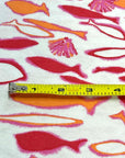 (COTTON BABY RIB) PINK, ORANGE AND RED FISH ON OFF WHITE