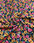 (TECHNO CREPE) BRIGHT PINK AND MUSTARD FLOWERS ON BLACK