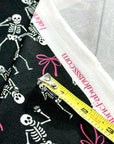 (OAKLEY) SKELETONS AND PINK BOWS ON BLACK