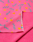 (HEAVY FRENCH TERRY) ORANGE TRIANGLES AND TURQUOISE SQUIGGLY ON PINK (2)