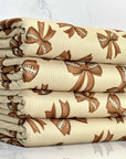 (4X2 RIB) FOOTBALL BOWS ON TAN