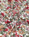 (DBP) CORAL, ORANGE, AND RED FLOWERS ON OFF WHITE