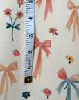 (SWIM) FLOWERS AND BOWS PATTERN ON CREAM