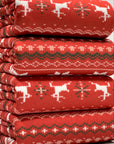 (SWEATER KNIT) OFF WHITE REINDEERS AND OFF WHITE POINSETTIA'S ON RED