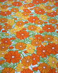 (WOVEN) ORANGE AND TANGERINE FLOWERS ON OFF WHITE