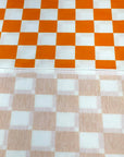 (FRENCH TERRY) ORANGE AND OFF WHITE CHECKERED