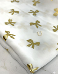 (WOVEN) GOLD BOWS ON OFF WHITE