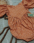 (2X2 YUMMY RIB) OFF WHITE AND FUCHSIA TINY FLOWERS ON ORANGE