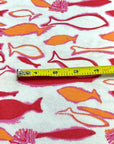 (COTTON BABY RIB) PINK, ORANGE AND RED FISH ON OFF WHITE