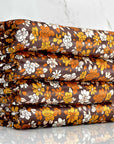 (VELVET) ORANGE AND OFF WHITE FLOWERS ON DARK BROWN
