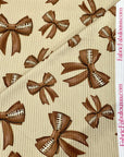 (4X2 RIB) FOOTBALL BOWS ON TAN