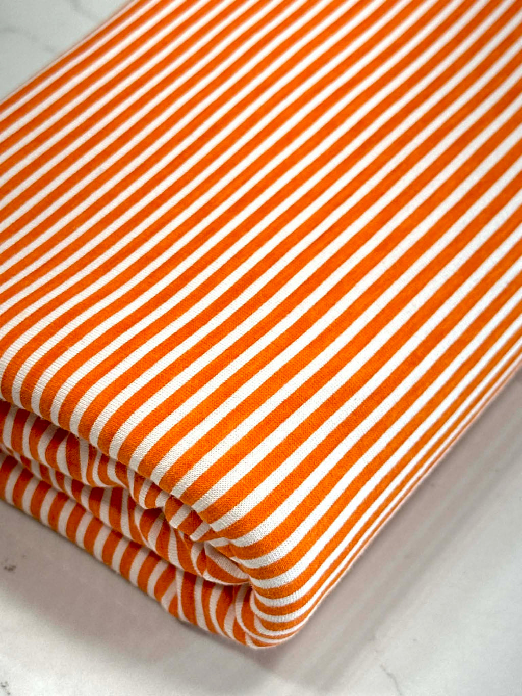 (KNIT) ORANGE AND OFF WHITE THIN STRIPES