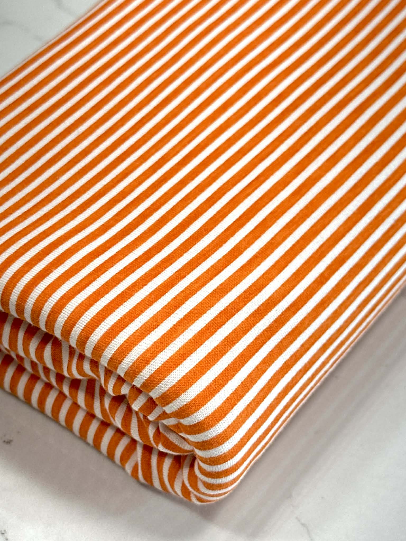 (KNIT) ORANGE AND OFF WHITE THIN STRIPES