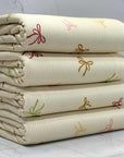 (4X2 RIB) LIGHT MUSTARD, BROWN, PINK AND GREEN BOWS ON CREAM
