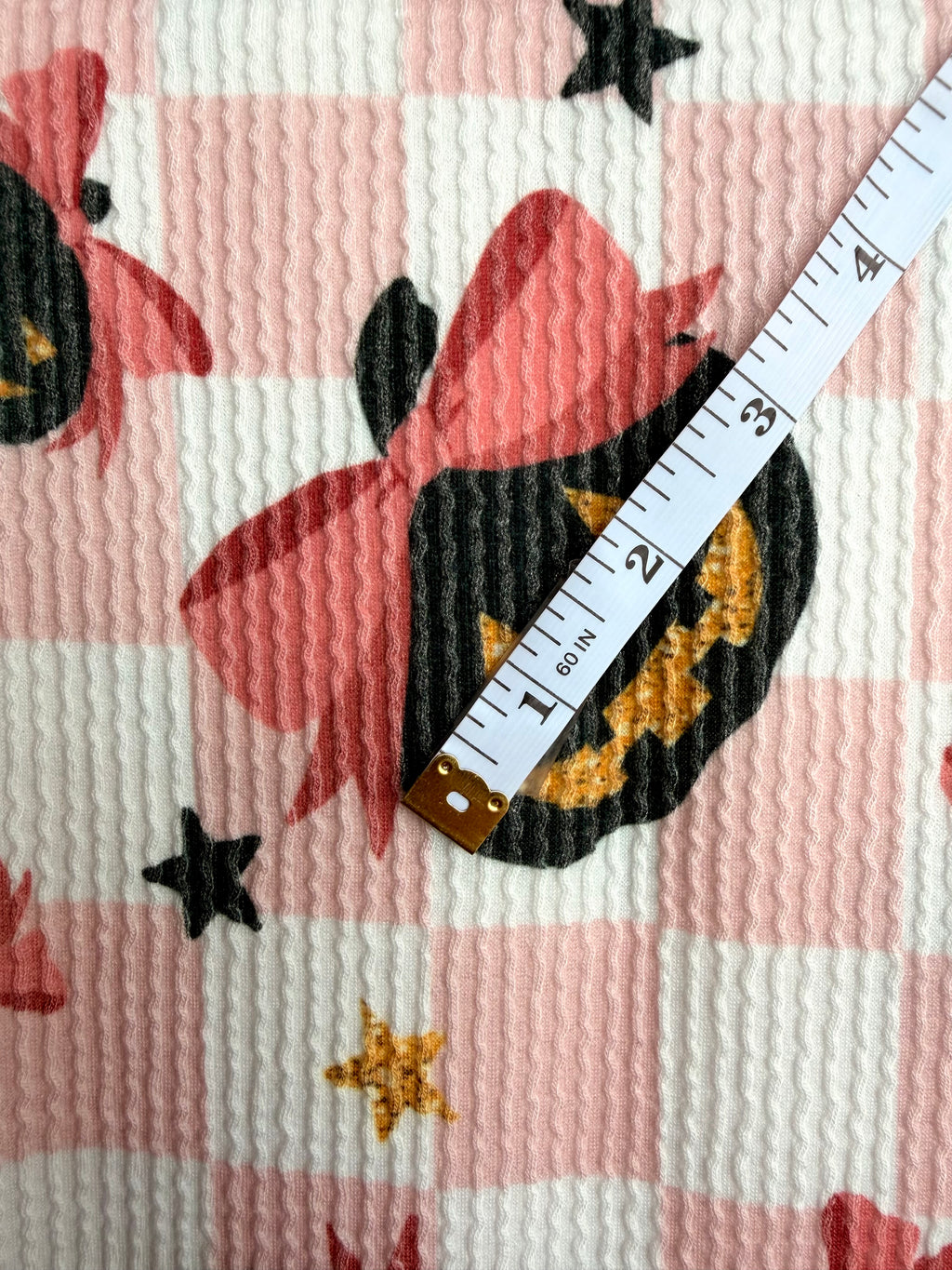 (URBAN RIB) BLACK PUMPKINS WITH BOWS AND STARS ON LIGHT PINK CHECKERED
