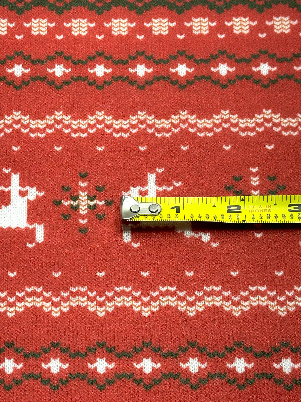 (SWEATER KNIT) OFF WHITE REINDEERS AND OFF WHITE POINSETTIA'S ON RED