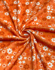 (2X2 YUMMY RIB) BURNT ORANGE AND OFF WHITE TINY FLOWERS ON ORANGE