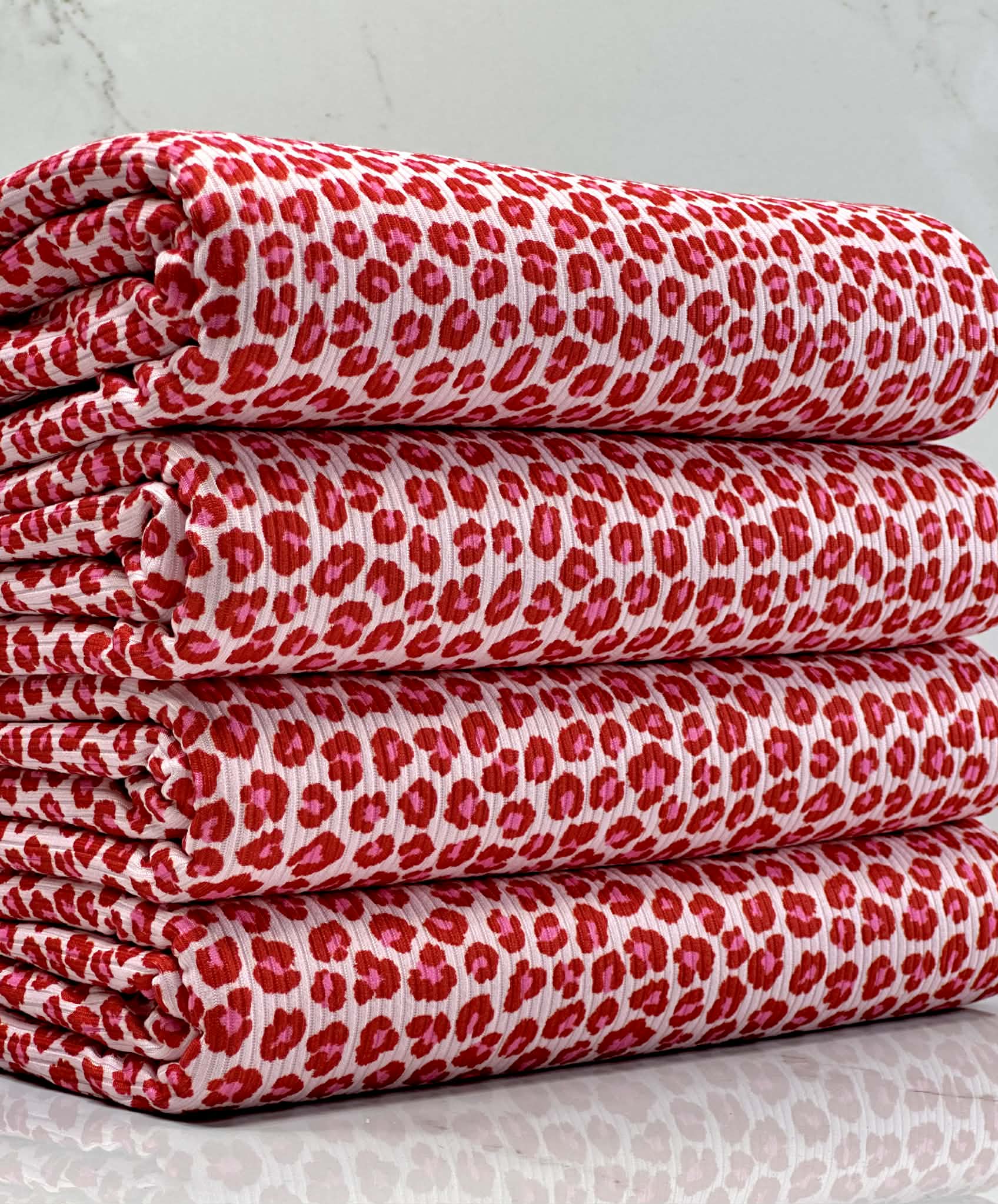 (2X2 BRUSHED RIB) PINK AND RED CHEETAH ON LIGHT PINK