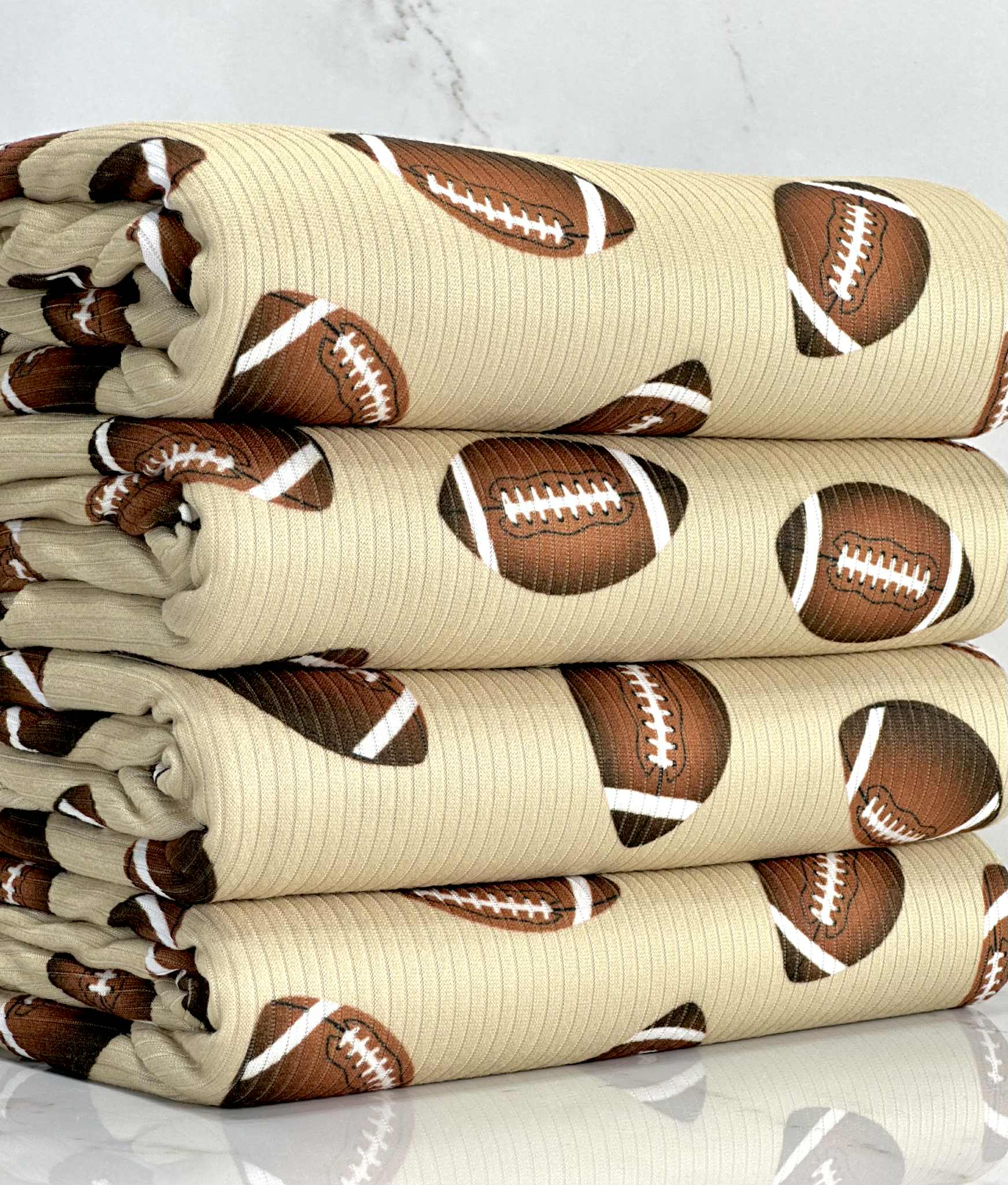 (4X2 RIB) FOOTBALLS ON TAN