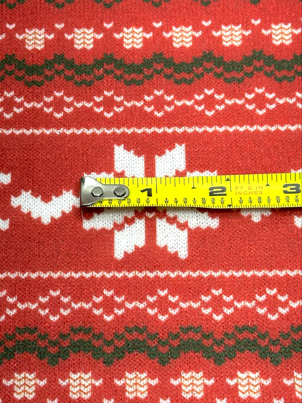 (SWEATER KNIT) OFF WHITE REINDEERS AND OFF WHITE POINSETTIA'S ON RED
