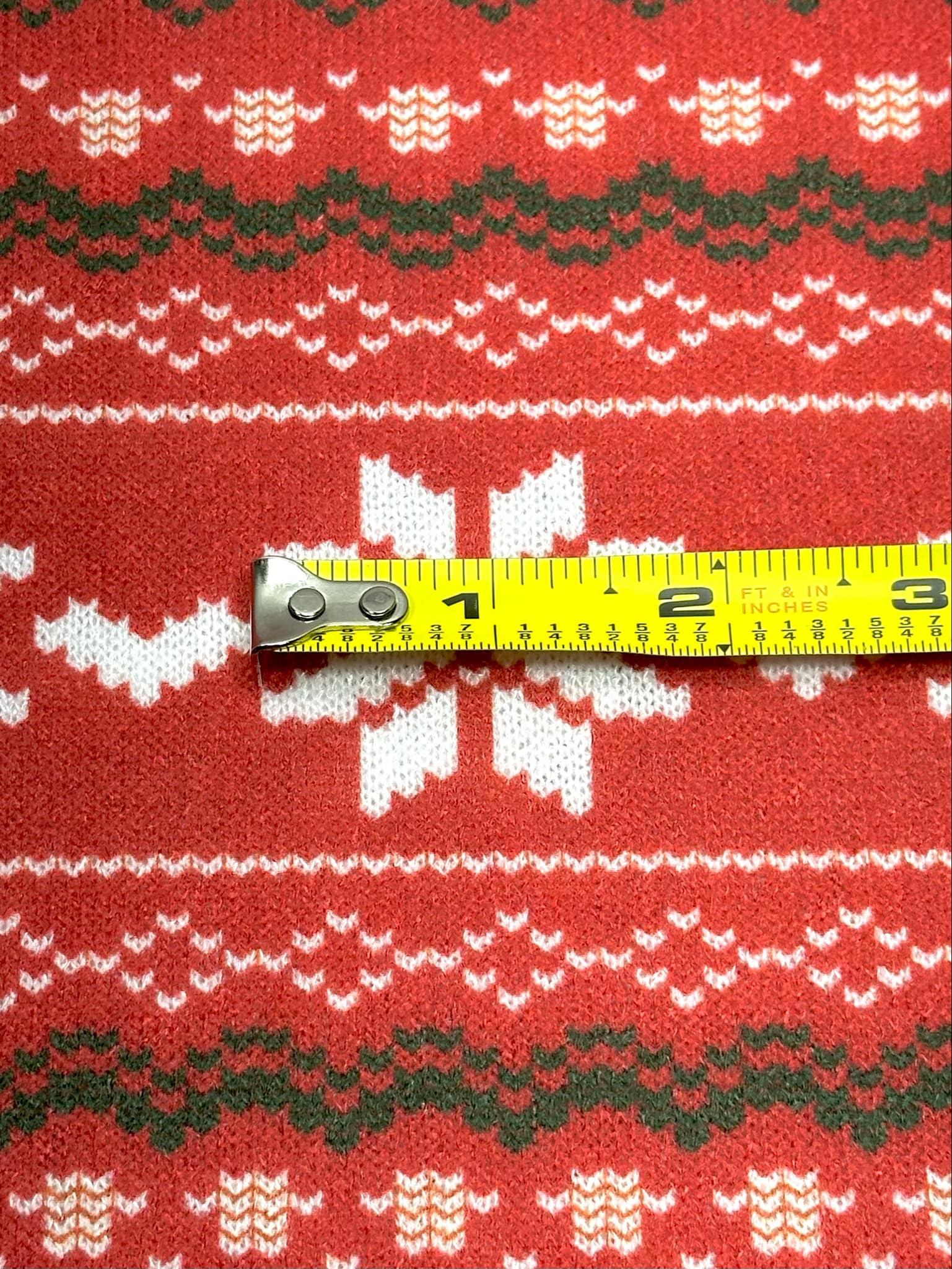 (SWEATER KNIT) OFF WHITE REINDEERS AND OFF WHITE POINSETTIA'S ON RED