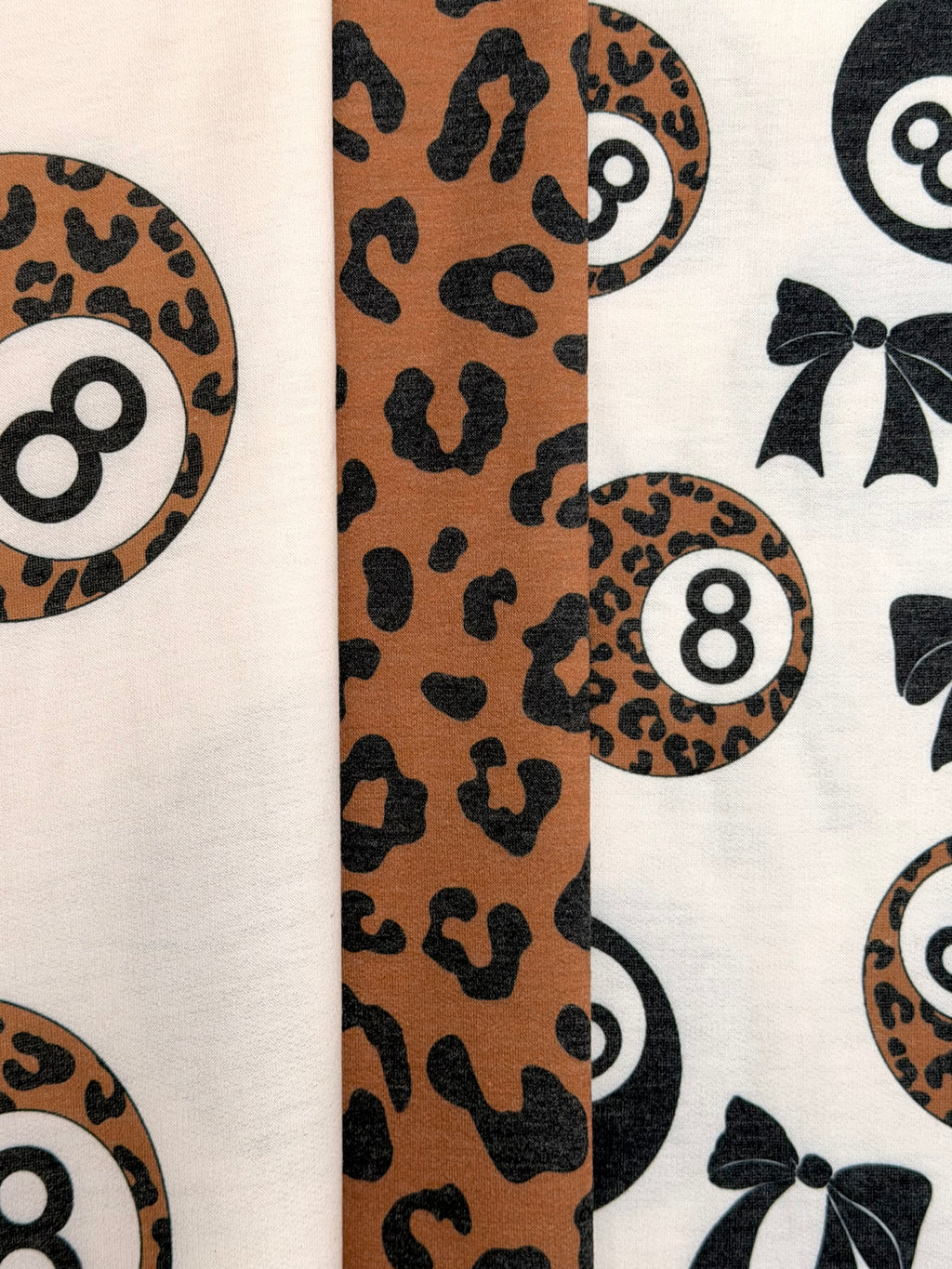 (FRENCH TERRY) BLACK BOW  AND LEOPARD 8-BALL PRINT ON CREAM