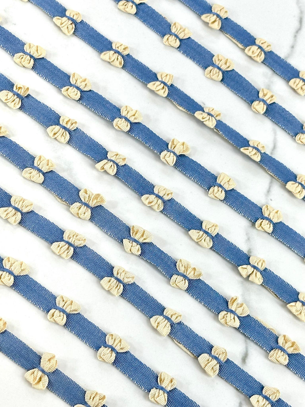 (TRIM) CREAM BOWS ON DENIM STRIP