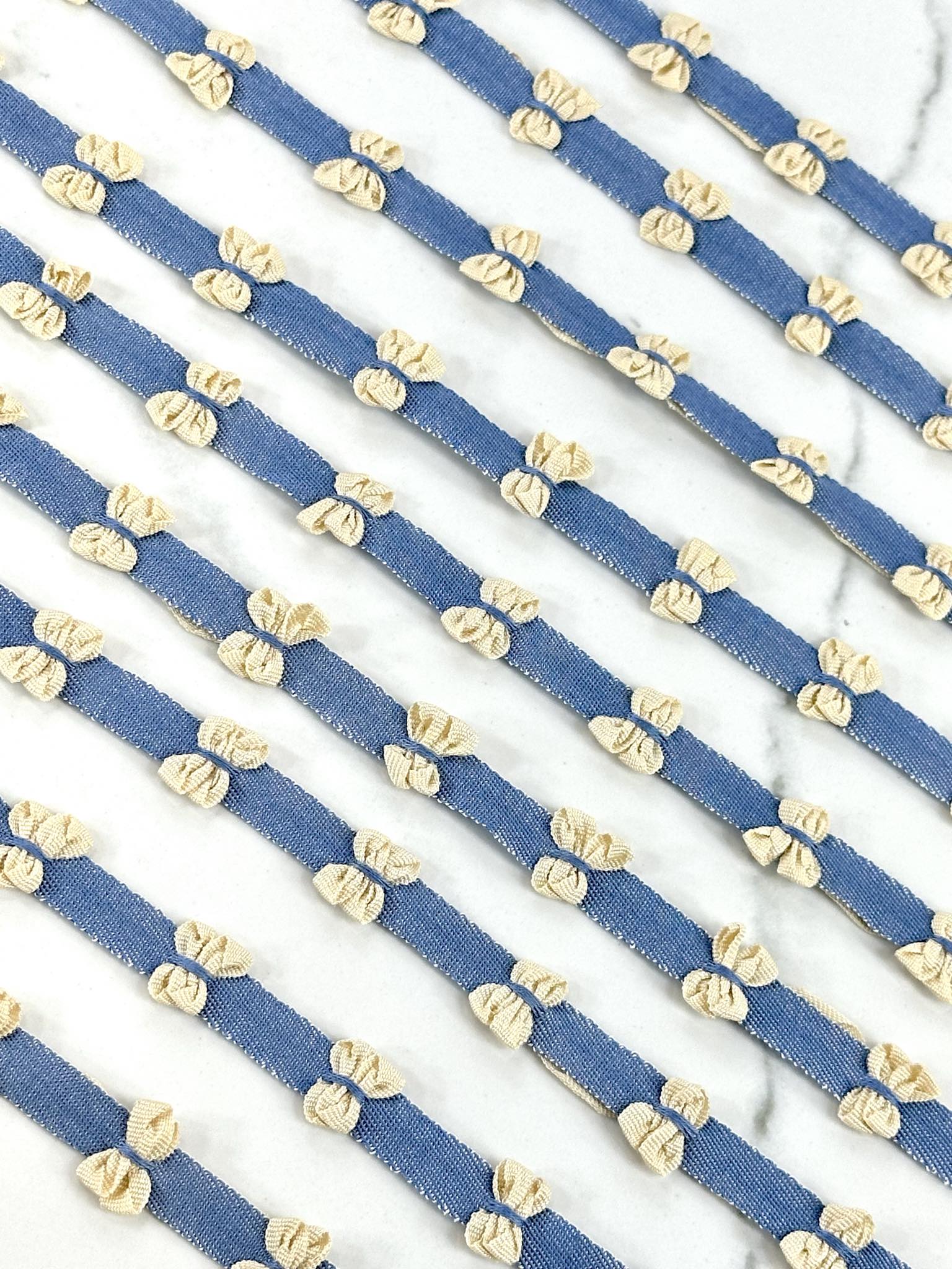 (TRIM) CREAM BOWS ON DENIM STRIP
