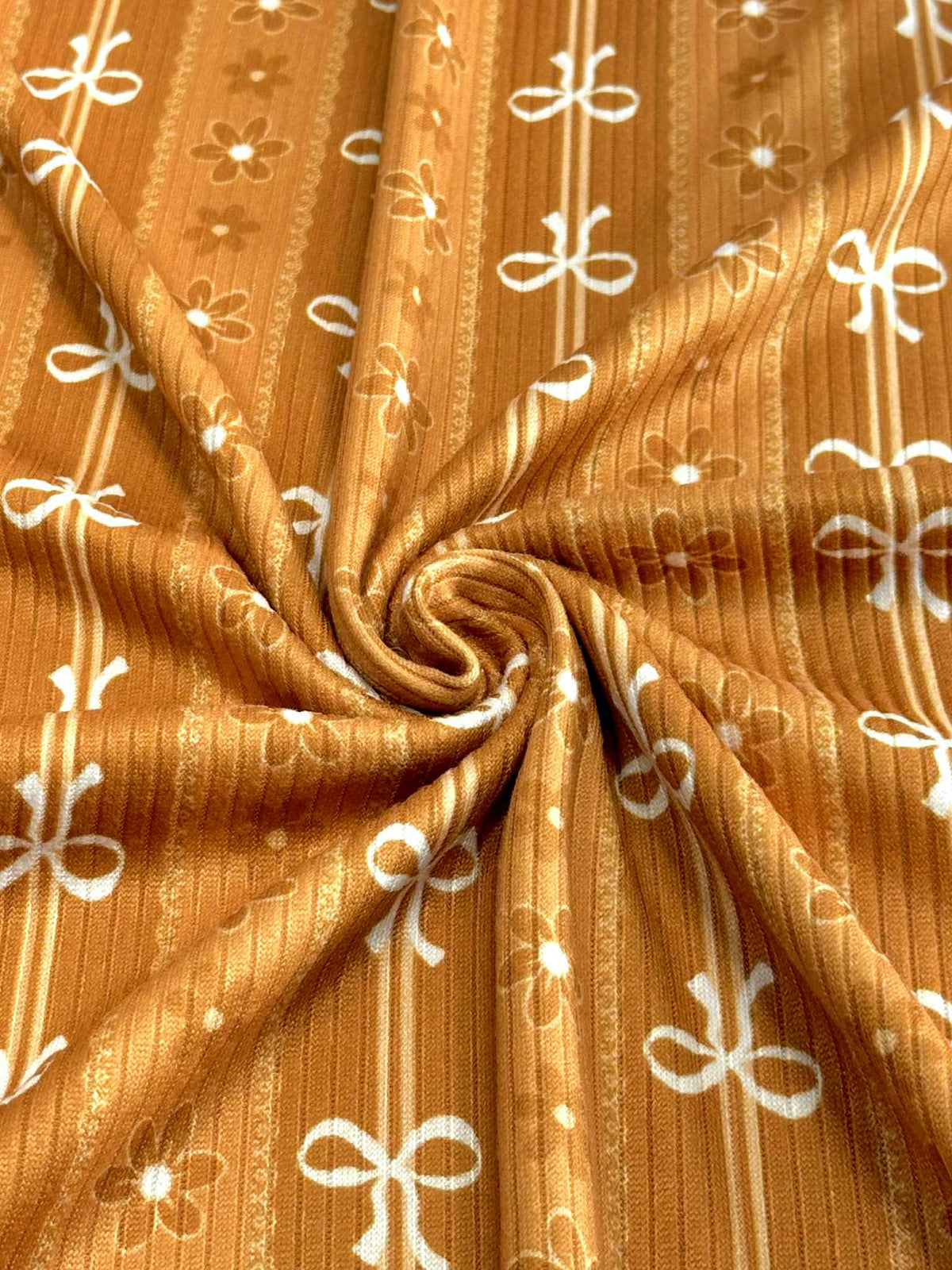 (4X2 RIB) FLOWER AND OFF WHITE BOWS PATTERN ON APRICOT