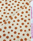 (THERMAL) TINY BURNT ORANGE FLOWERS ON CREAM
