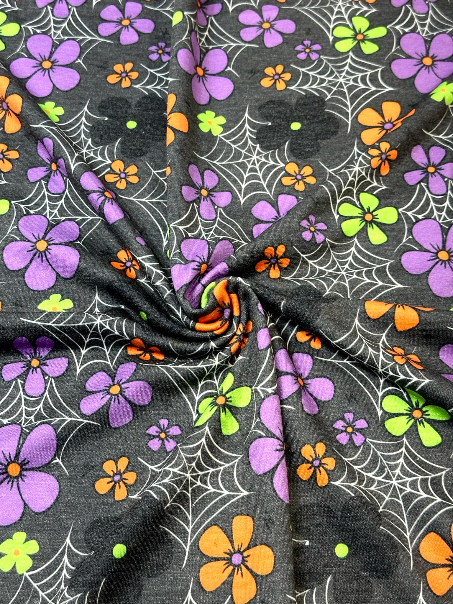 (FRENCH TERRY) SMALL COLORFUL FLOWERS & SPIDERWEBS ON CHARCOAL