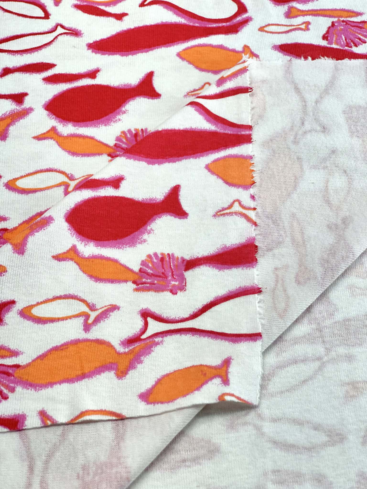 (COTTON BABY RIB) PINK, ORANGE AND RED FISH ON OFF WHITE