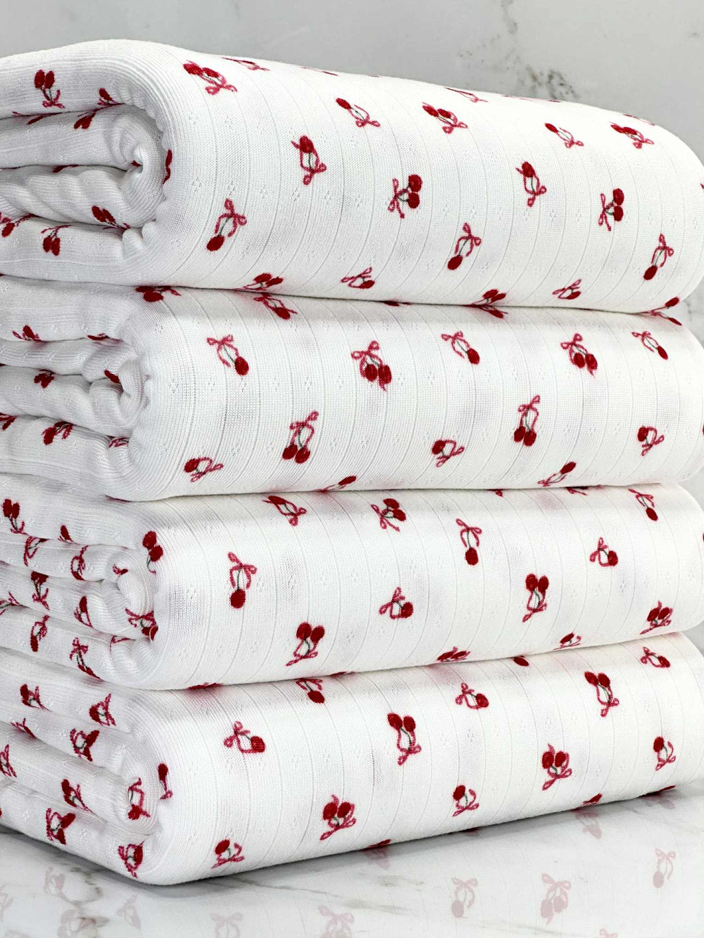 (POINTELLE RIB) TINY RED CHERRIES WITH BOWS ON OFF WHITE