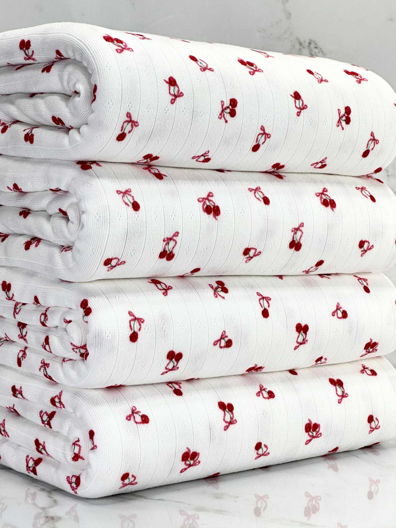 (POINTELLE RIB) TINY RED CHERRIES WITH BOWS ON OFF WHITE