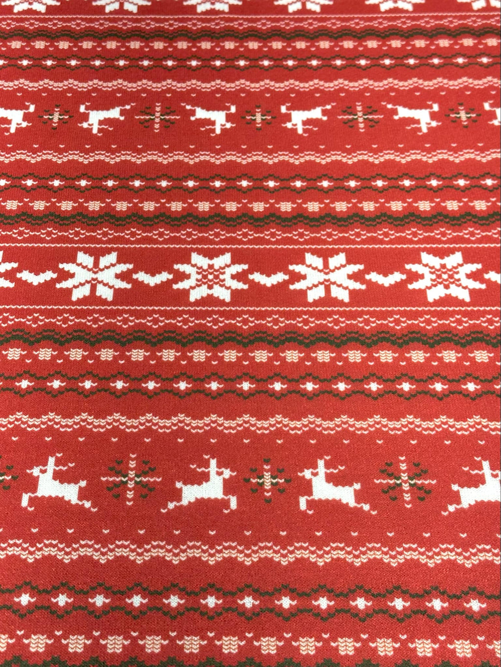 (SWEATER KNIT) OFF WHITE REINDEERS AND OFF WHITE POINSETTIA'S ON RED