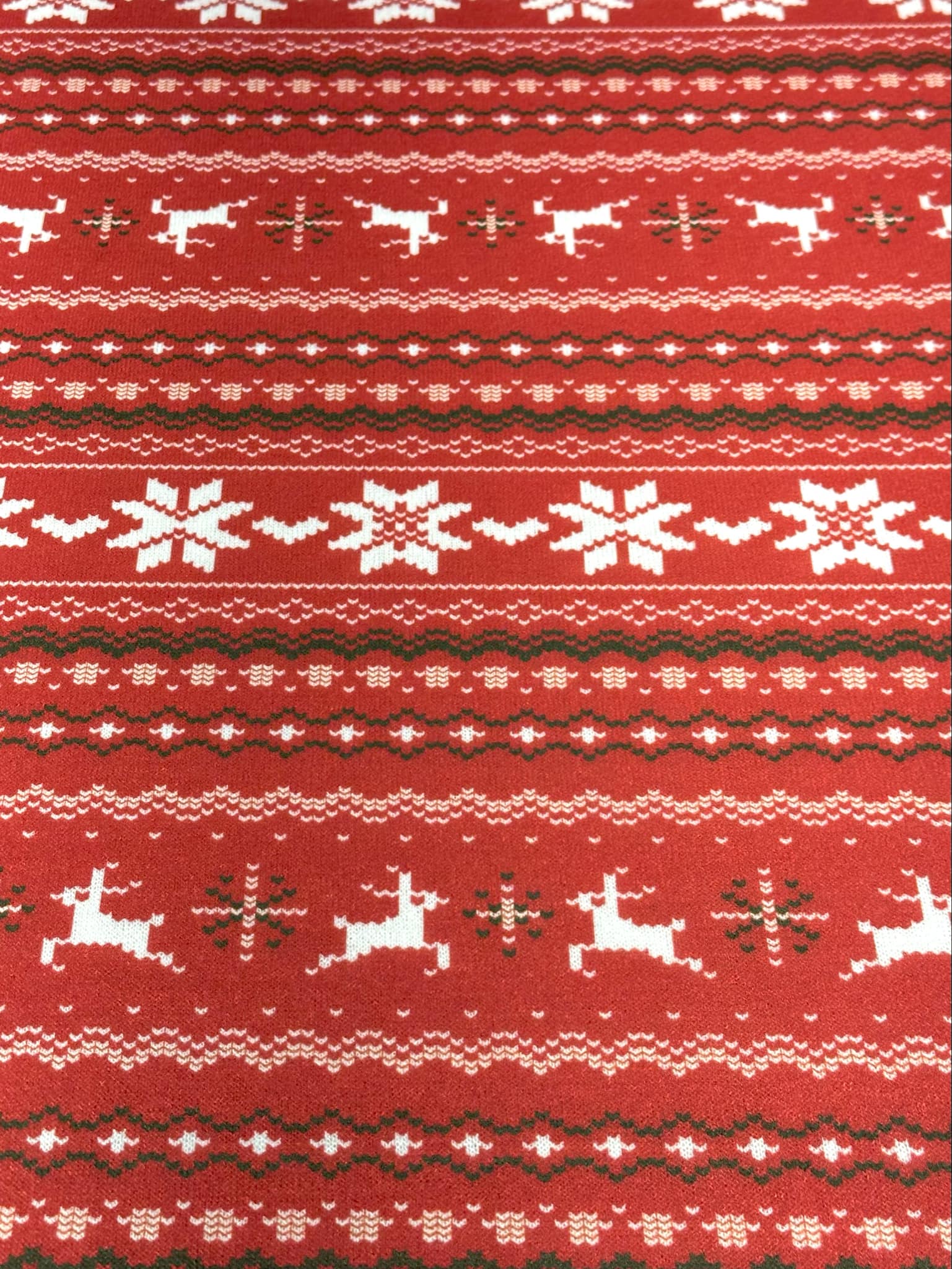 (SWEATER KNIT) OFF WHITE REINDEERS AND OFF WHITE POINSETTIA'S ON RED