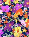 (SWEATER KNIT) PURPLE, ORANGE, YELLOW AND PINK FLOWERS ON NAVY