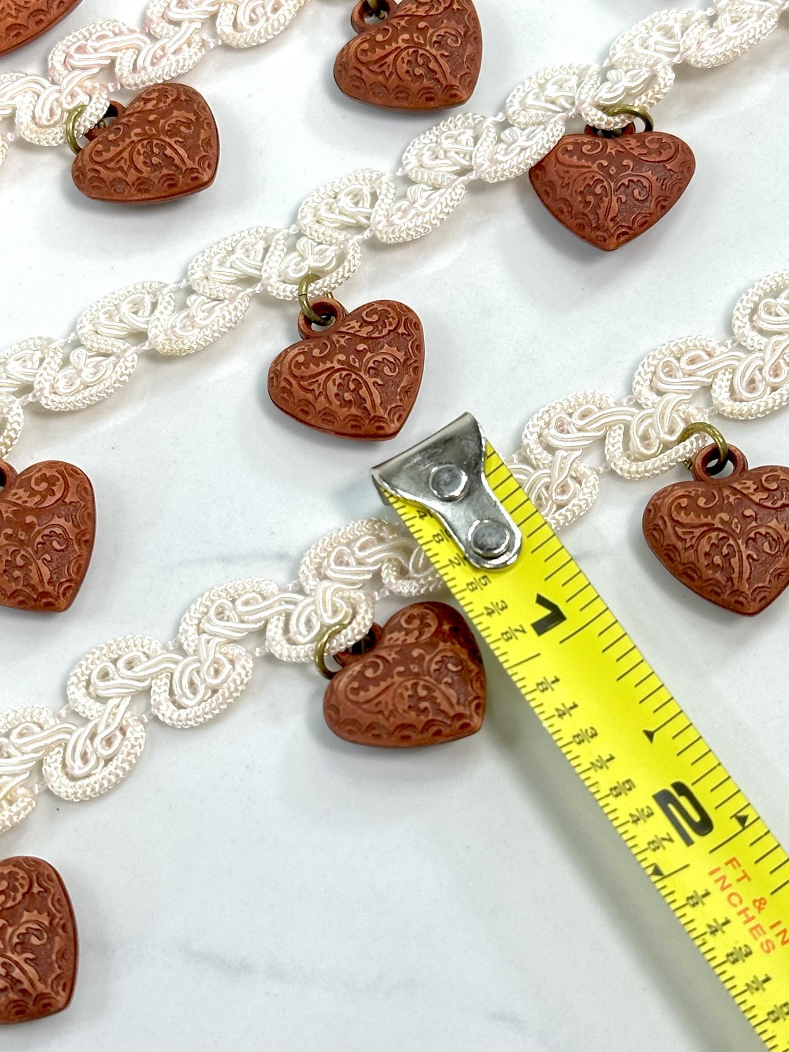 (TRIM) IVORY STRIP WITH VINTAGE HEART CHARMS