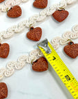 (TRIM) IVORY STRIP WITH VINTAGE HEART CHARMS