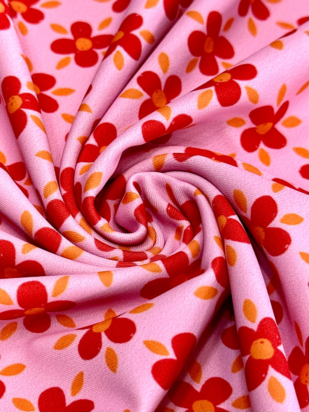 (SWIM) RED AND ORANGE FLOWERS ON PINK