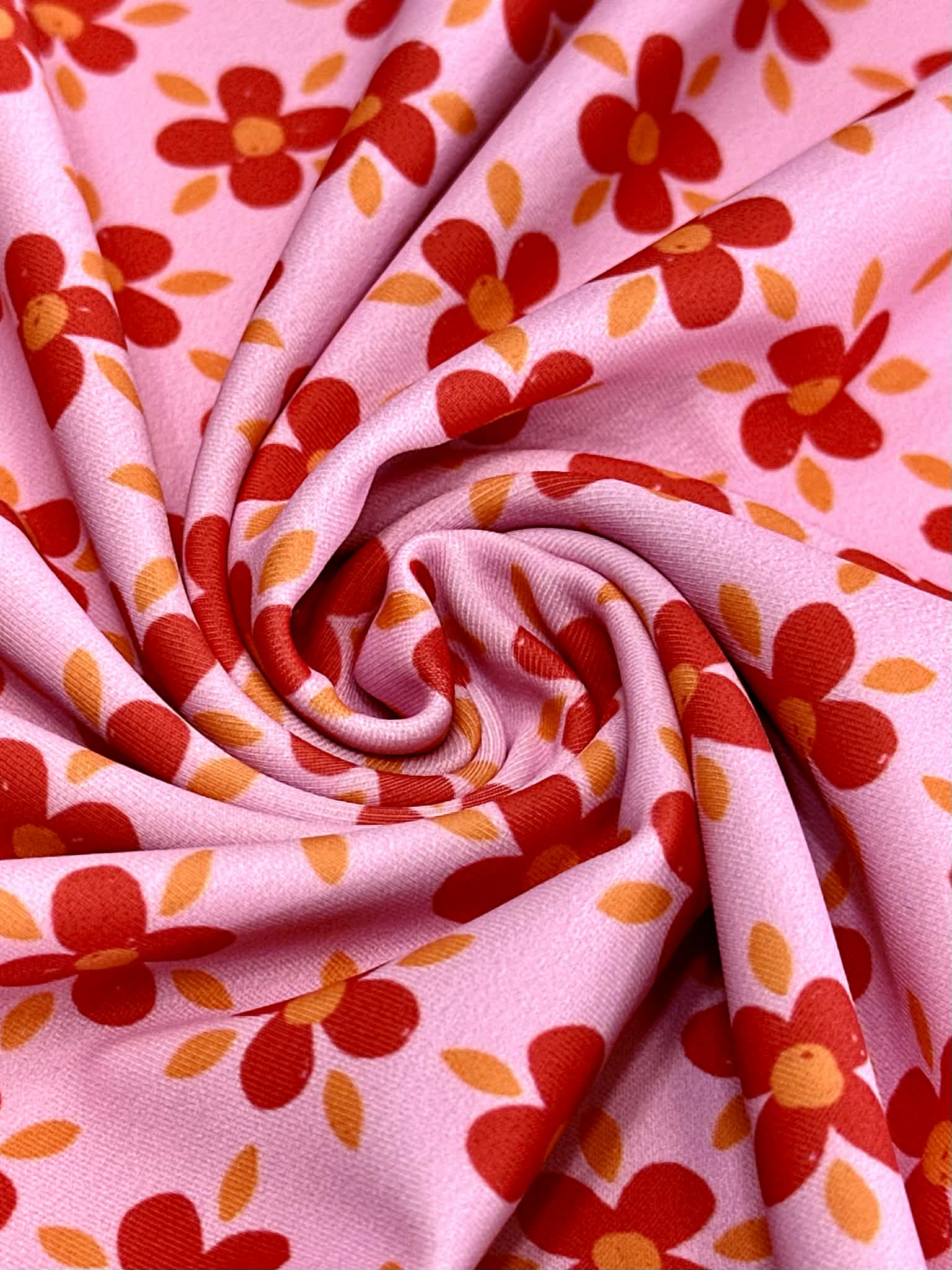 (SWIM) RED AND ORANGE FLOWERS ON PINK