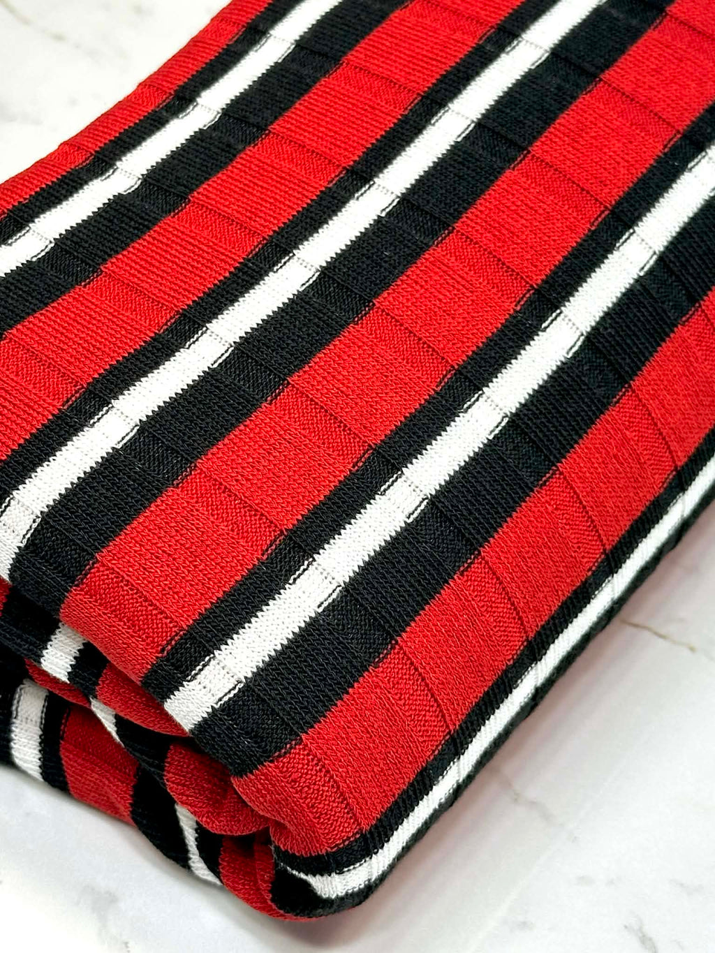 (SWEATER RIB) BLACK AND WHITE STRIPES ON RED