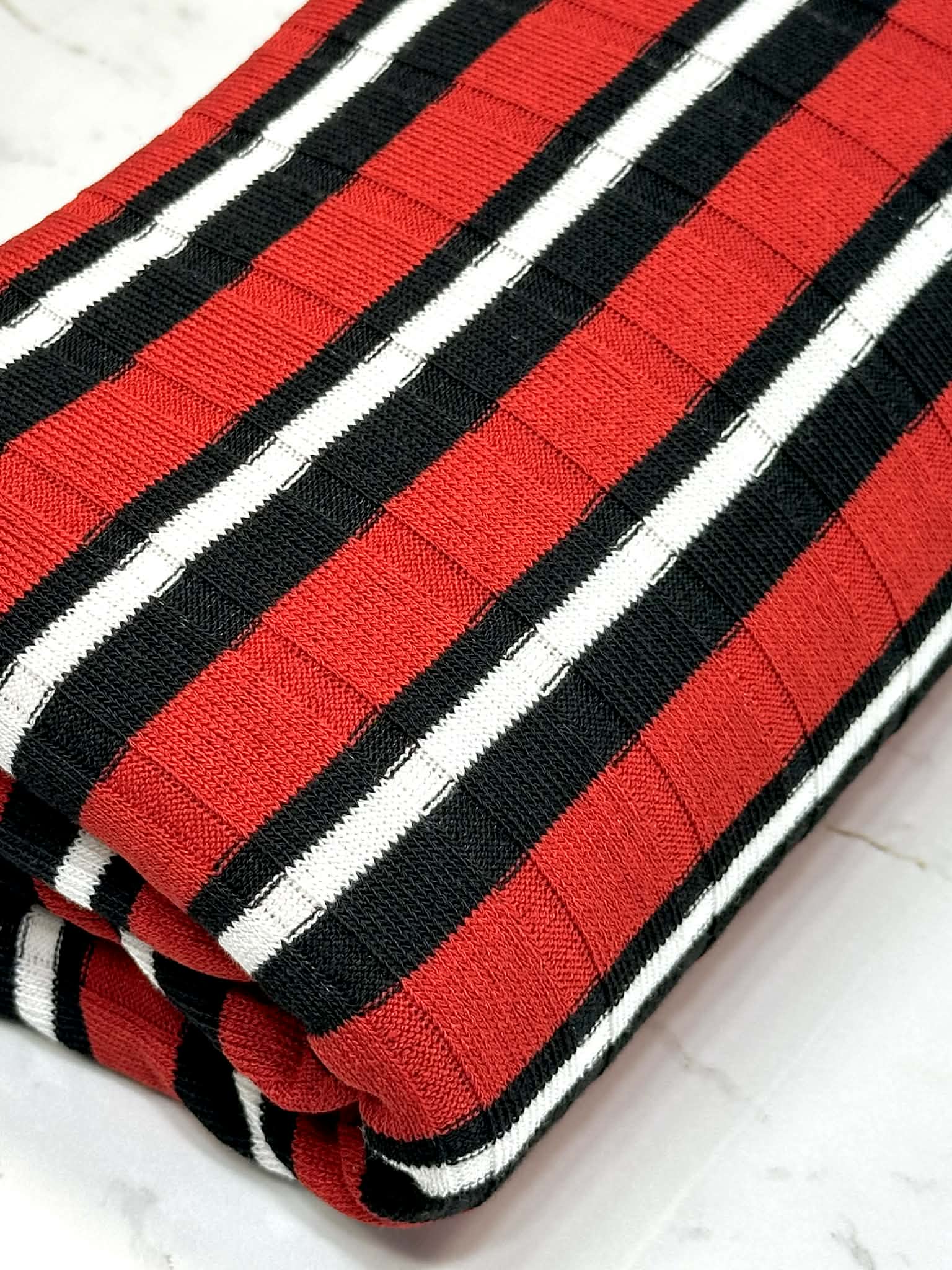 (SWEATER RIB) BLACK AND WHITE STRIPES ON RED