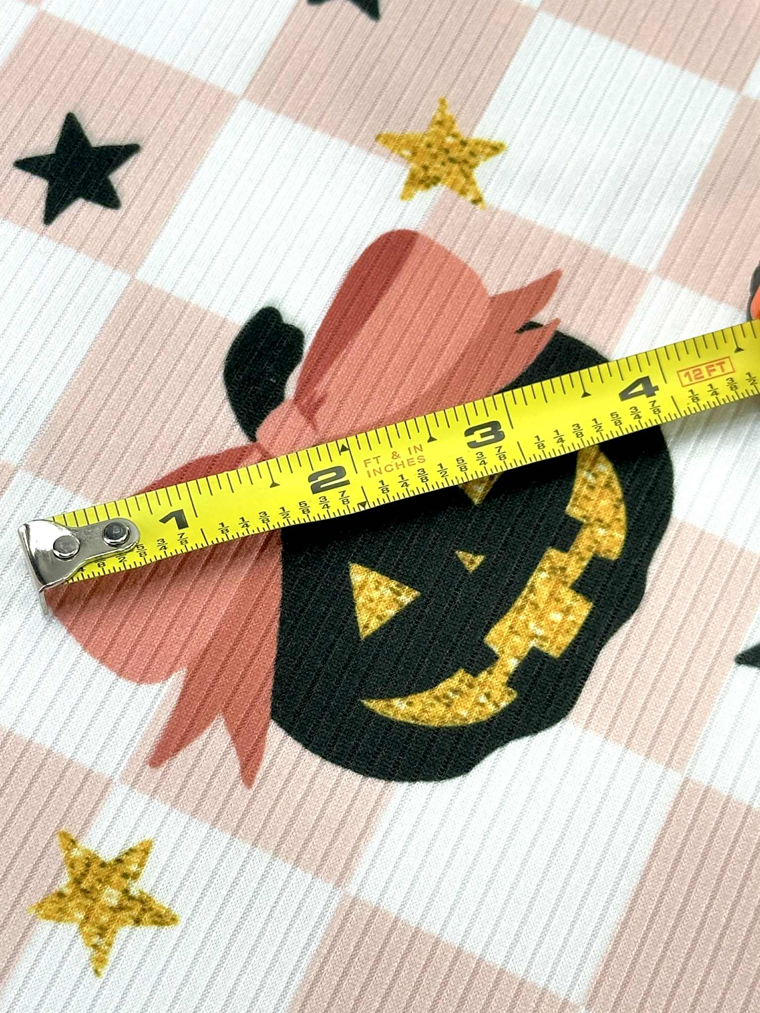 (YUMMY RIB) BLACK PUMPKINS WITH BOWS AND STARS ON LIGHT PINK CHECKERED