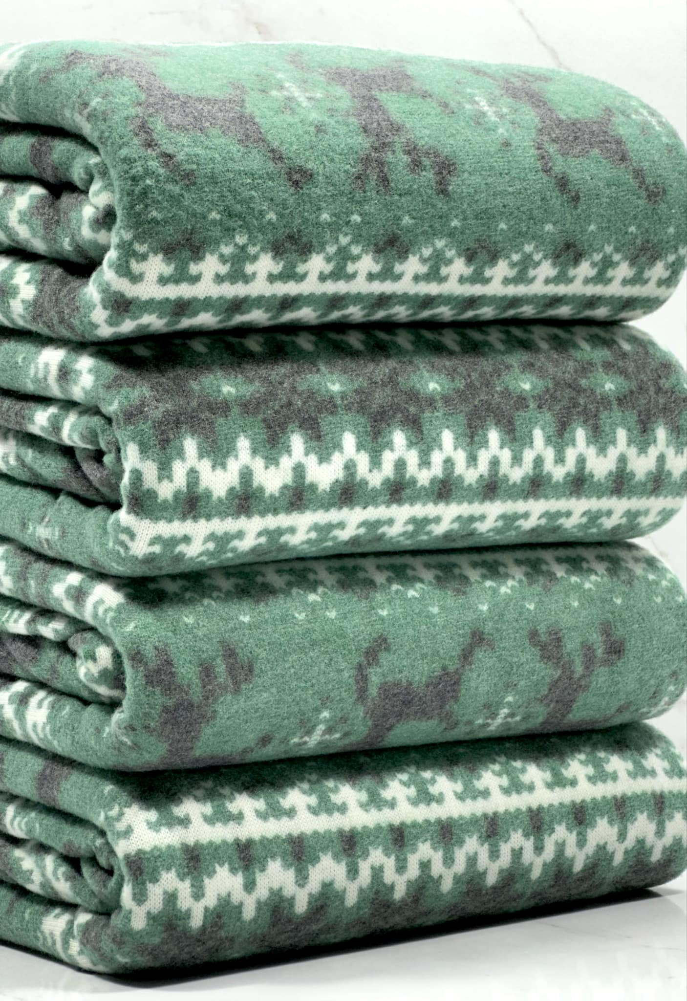 (BRUSHED SWEATER KNIT) BLACK REINDEERS ON DARK GREEN