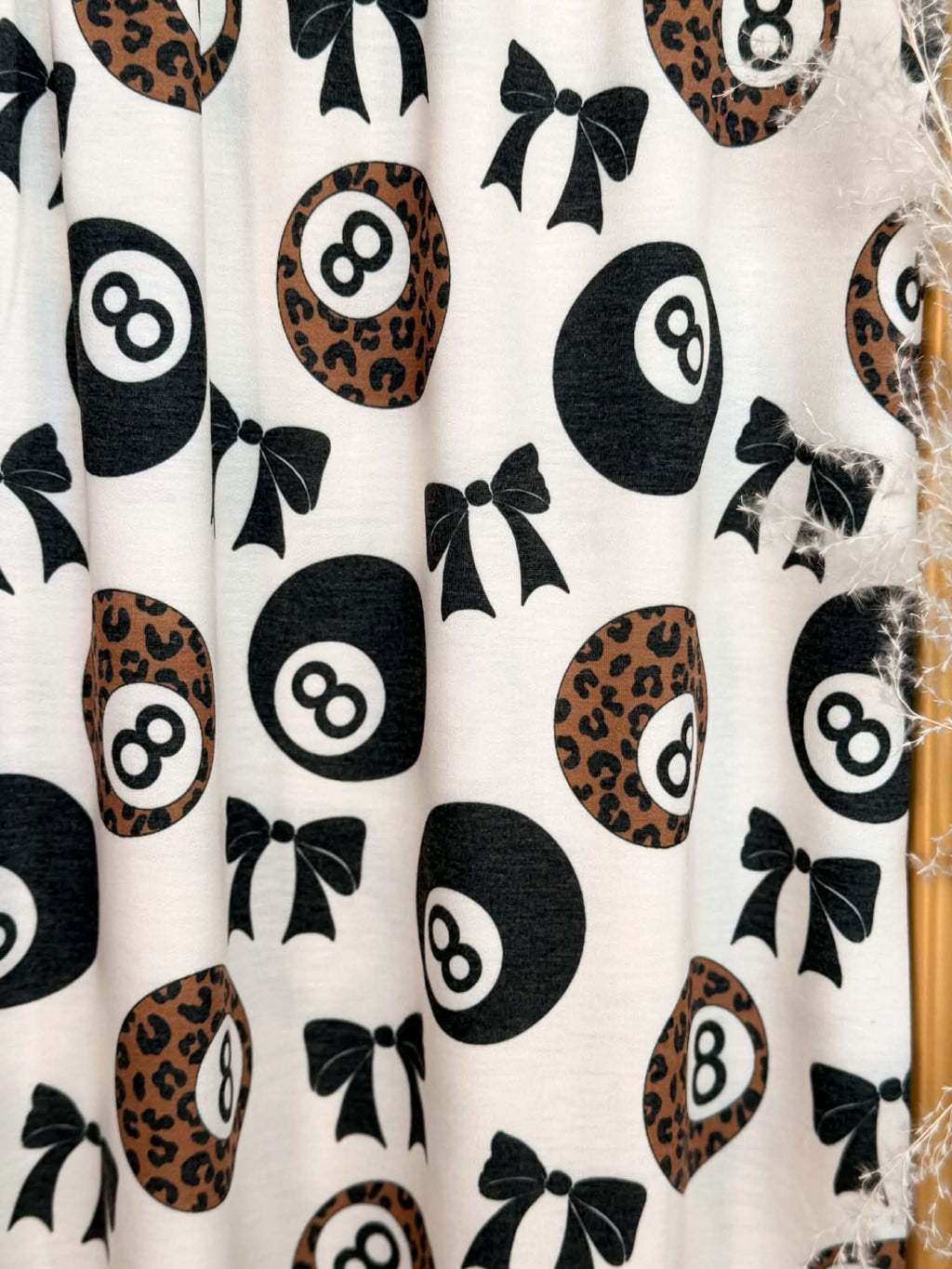 (FRENCH TERRY) BLACK BOW  AND LEOPARD 8-BALL PRINT ON CREAM