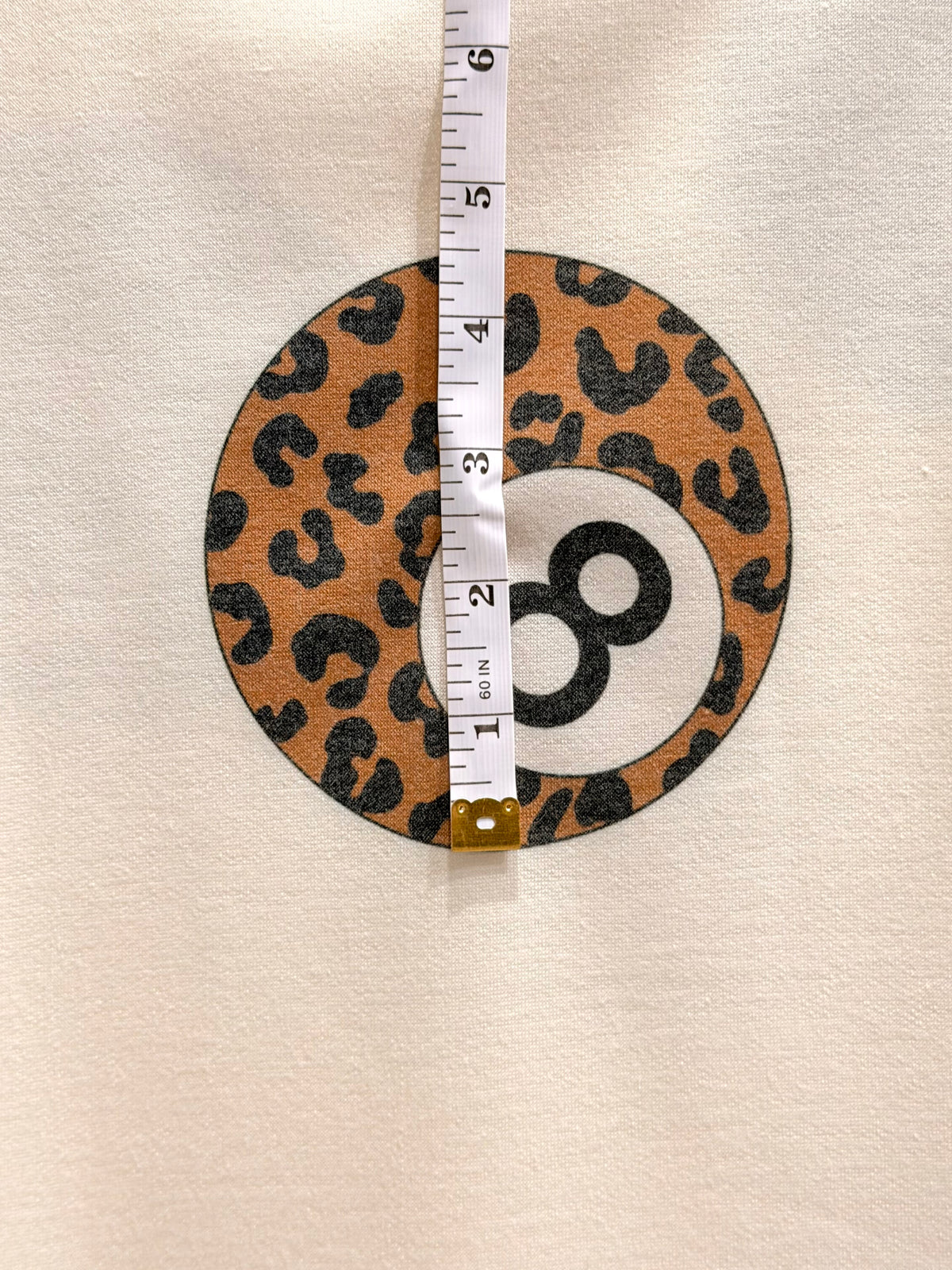(FRENCH TERRY) BLACK AND LEOPARD 8-BALL PRINT ON CREAM